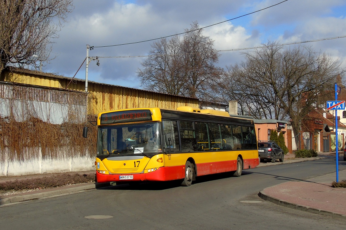 70217
Scania (ex. A517) skrÄca w ul. KowalskÄ jadÄc w obsĹudze kursu "5520" linii numer 3 w relacji Grodzisk Maz. Dw. PKP (13:25)-KĹudzienko PÄtla (13:50). 
